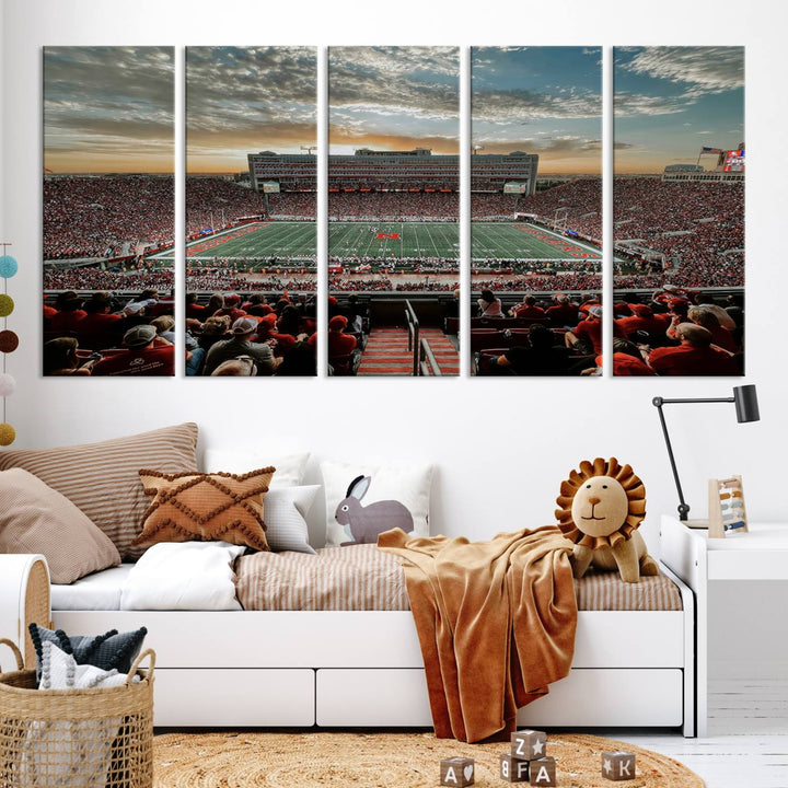 The living room features a stunning triptych of Lincoln Memorial Stadium wall art canvas print, celebrating the University of Nebraska Cornhuskers football team. This piece serves as captivating wall art, showcasing a gallery-quality finish.