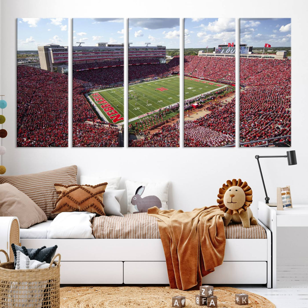 The University of Nebraska Cornhuskers Football Team Print showcases a vibrant triptych of Lincoln Memorial Stadium, depicting a packed football stadium filled with energetic fans. This handmade art piece is crafted in the USA and printed on premium canvas for a gallery-quality finish.