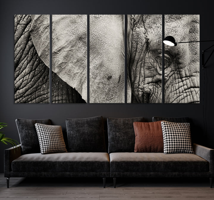 A modern living room features a large Elephant Wall Art Canvas Print in black and white, crafted on museum-quality canvases with UV-protective coating to maintain its elegance.