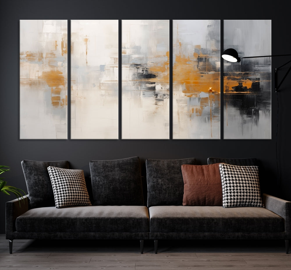 The Orange Pastel Abstract Wall Art Canvas Print, featuring a triptych of orange, white, and black hues, is elegantly displayed on museum-quality canvas.