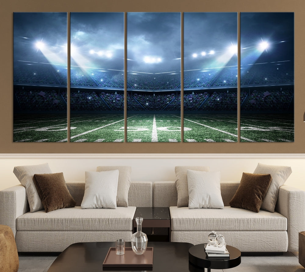 The *American Football Stadium Wall Art Canvas Print*, showcasing a lit football stadium, hangs prominently.