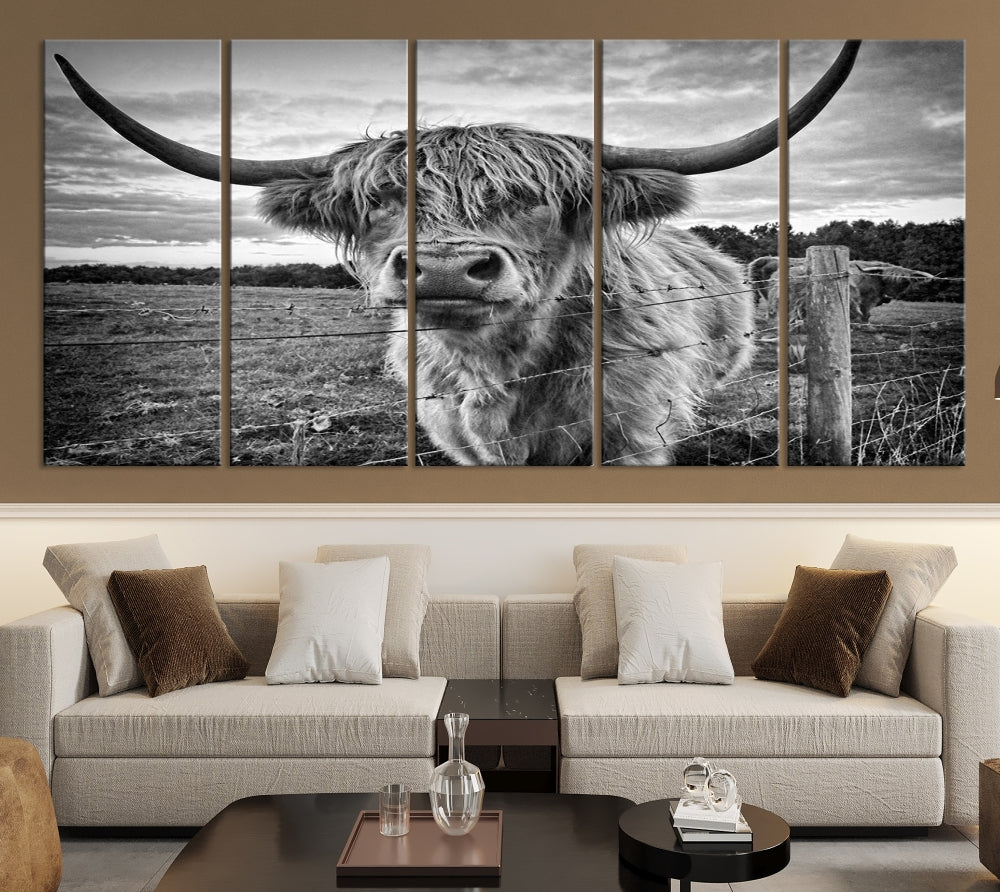 The "Scottish Highland Cow Canvas Wall Art Farmhouse Decor" adds a touch of rustic charm to your living room wall above the couch.