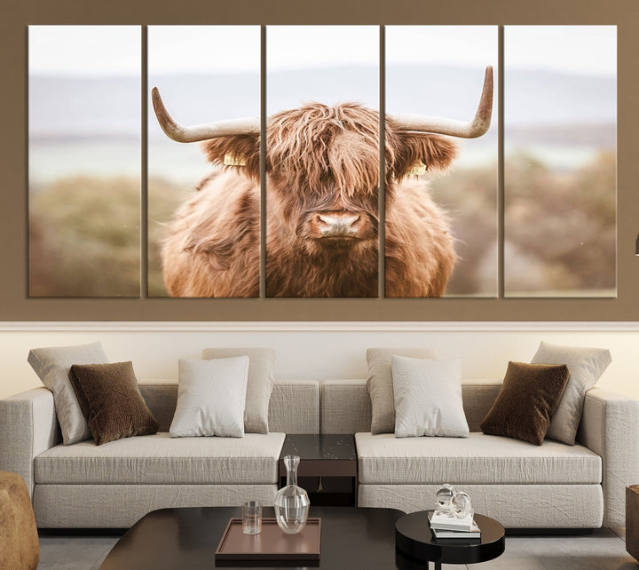 Canvas wall art featuring a Highland cow with long, shaggy fur in natural pastel tones, ready to hang.