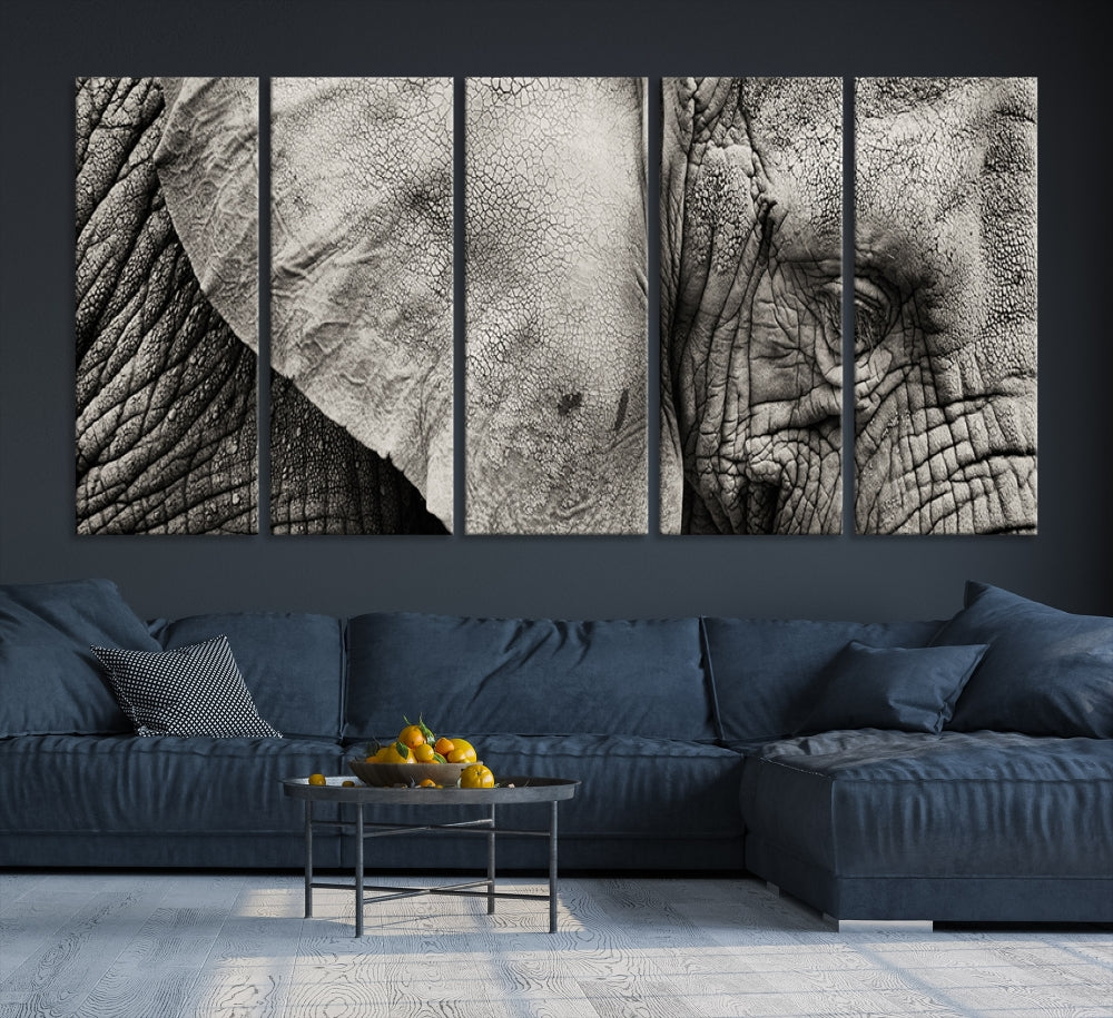 A modern living room features a large Elephant Wall Art Canvas Print in black and white, crafted on museum-quality canvases with UV-protective coating to maintain its elegance.