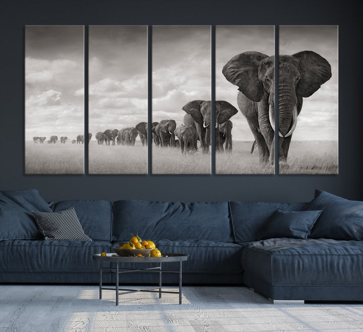 The Elephant Wall Art Canvas Print features a triptych of elephants in a savanna, elegantly displayed.