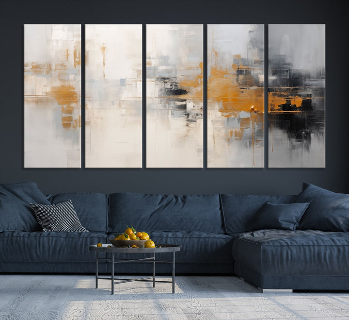 The Orange Pastel Abstract Wall Art Canvas Print, featuring a triptych of orange, white, and black hues, is elegantly displayed on museum-quality canvas.