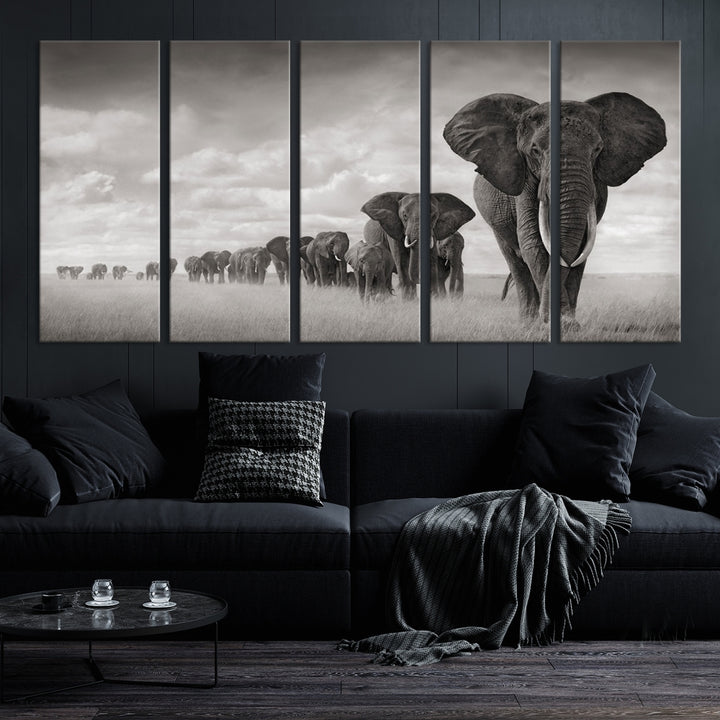 The Elephant Wall Art Canvas Print features a triptych of elephants in a savanna, elegantly displayed.