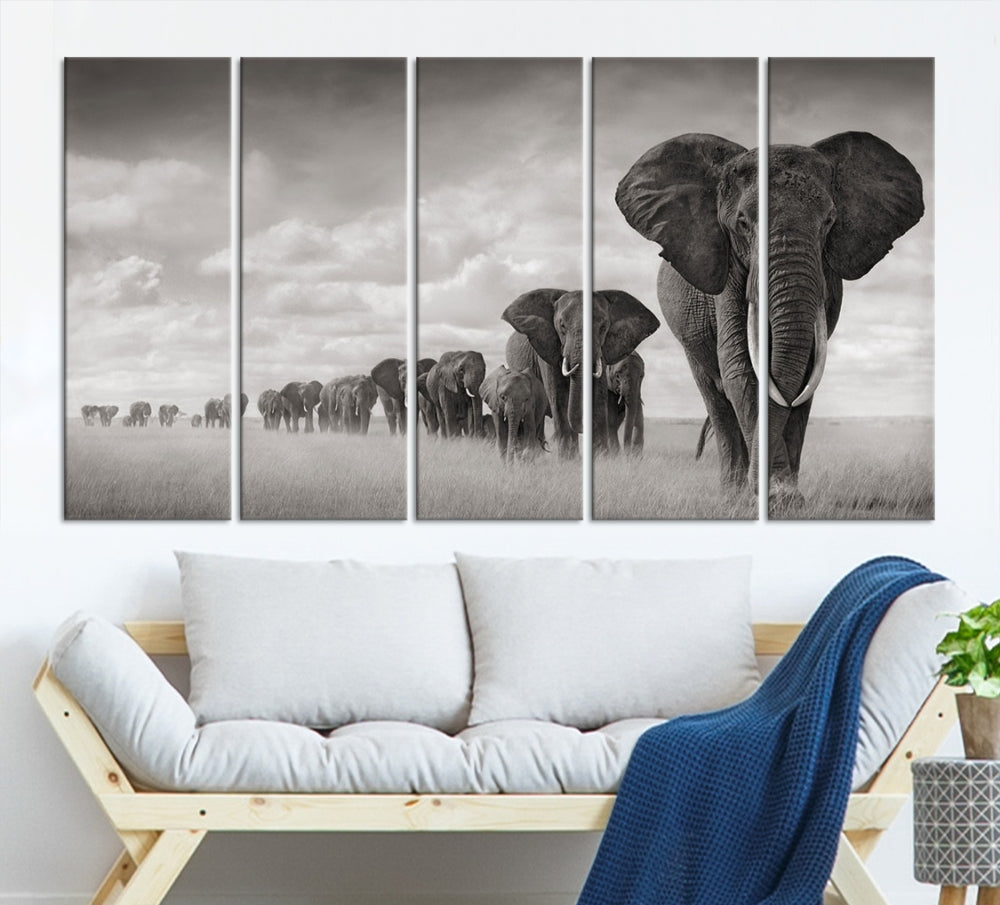 The Elephant Wall Art Canvas Print features a triptych of elephants in a savanna, elegantly displayed.