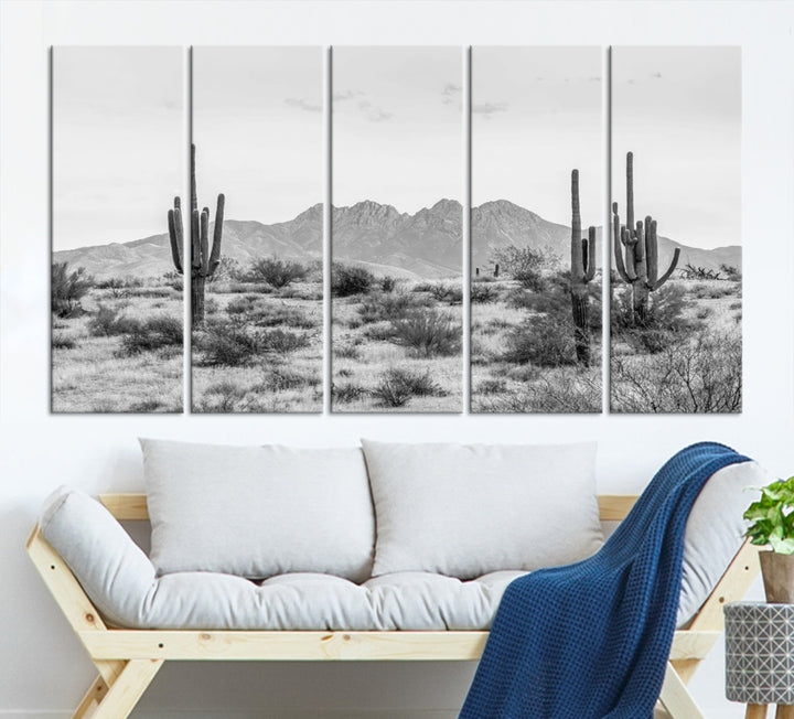 The modern living room showcases the "Black White Arizona Desert Canvas Wall Art Cactus Farmhouse Wall Art," a triptych consisting of gallery-wrapped, museum-quality black-and-white desert landscape photographs featuring cacti.