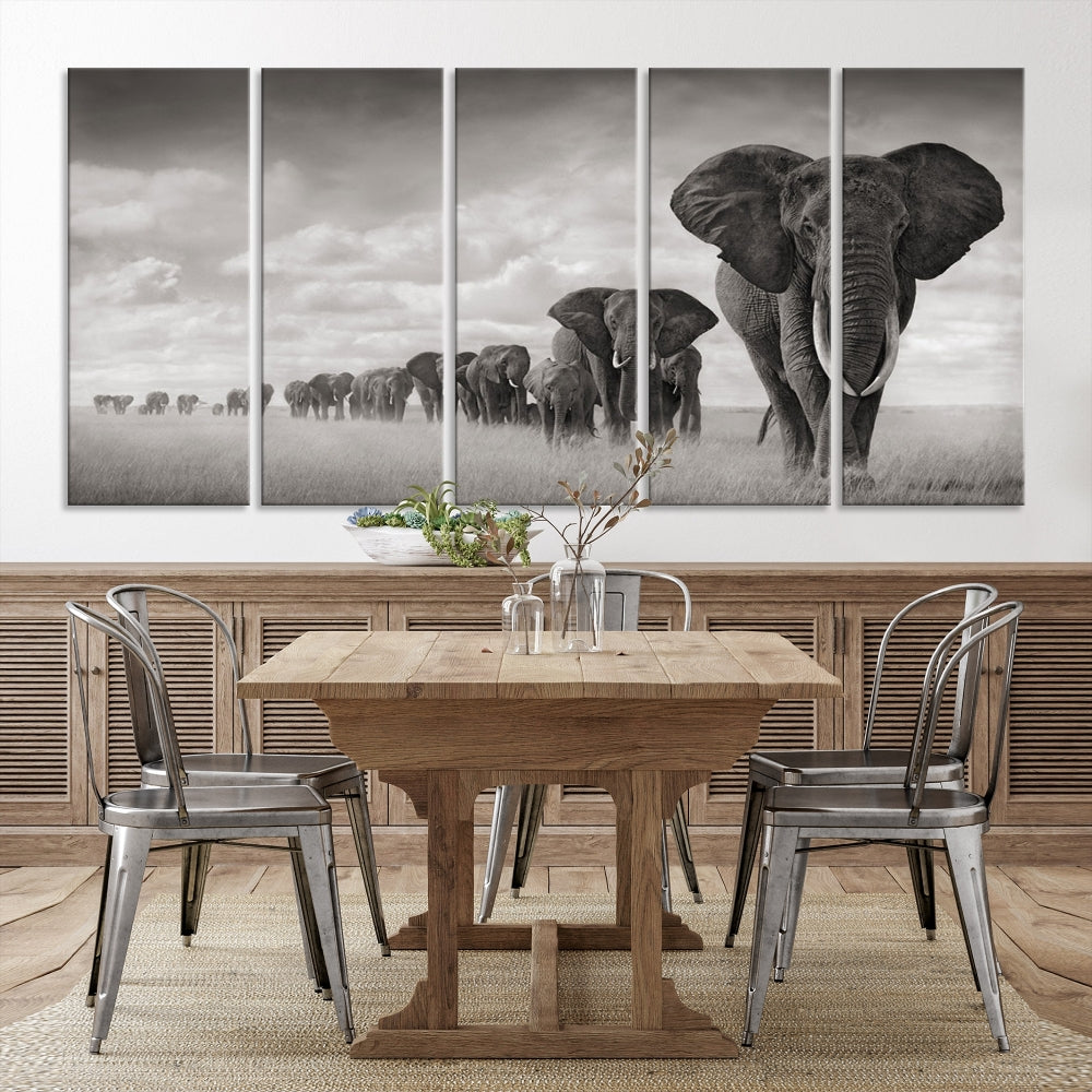 The Elephant Wall Art Canvas Print features a triptych of elephants in a savanna, elegantly displayed.