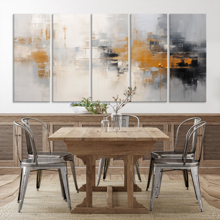 The Orange Pastel Abstract Wall Art Canvas Print, featuring a triptych of orange, white, and black hues, is elegantly displayed on museum-quality canvas.