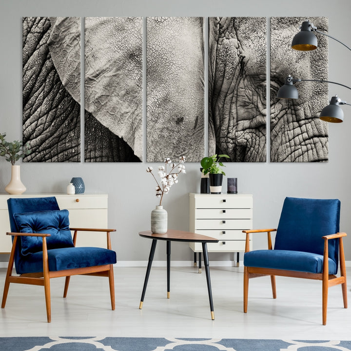 A modern living room features a large Elephant Wall Art Canvas Print in black and white, crafted on museum-quality canvases with UV-protective coating to maintain its elegance.