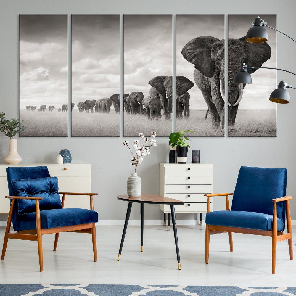 The "Herd of Elephants Wall Art Canvas Print" features an elegant black and white triptych of elephants walking in a line, beautifully displayed on museum-quality canvas with a UV-protective coating. This artwork arrives ready to hang and adds sophistication to any space.