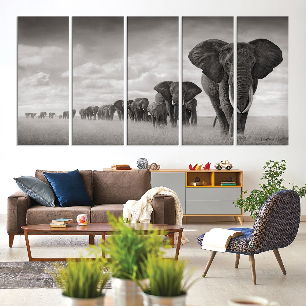 The Elephant Wall Art Canvas Print features a triptych of elephants in a savanna, elegantly displayed.