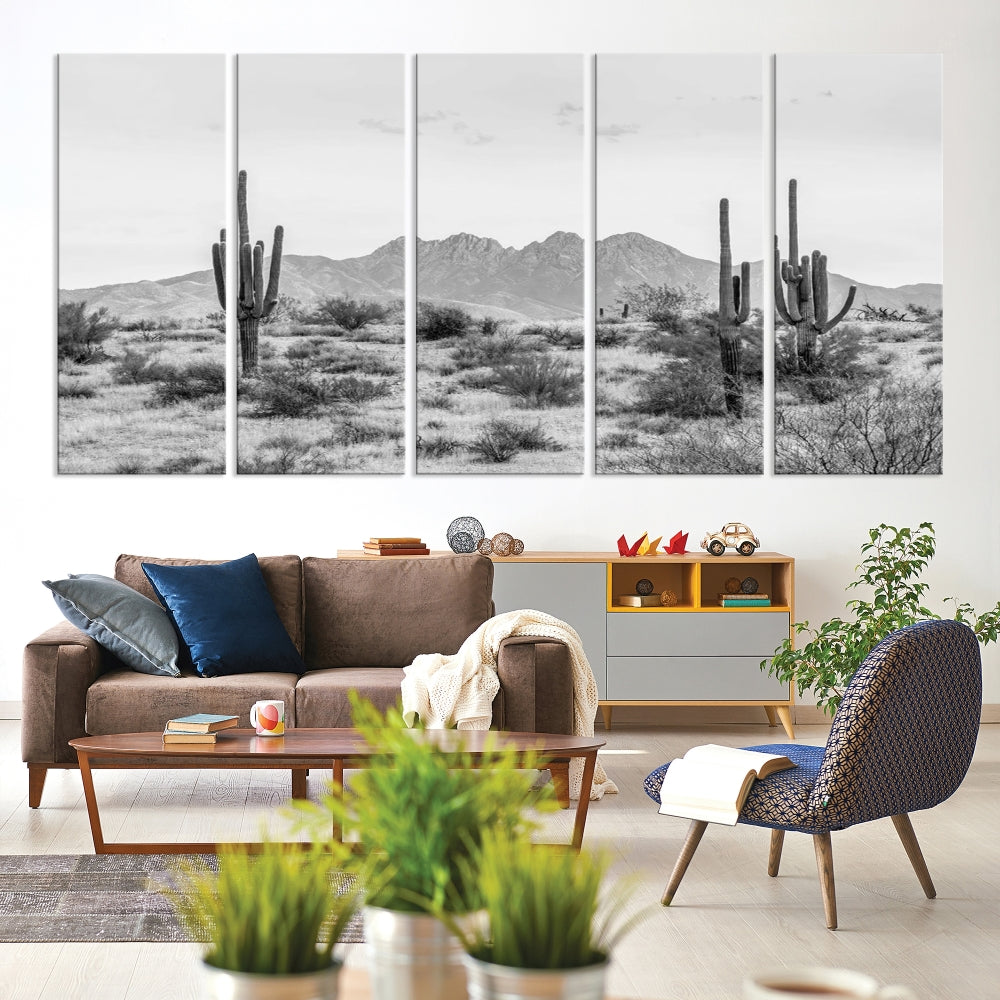 The modern living room showcases the "Black White Arizona Desert Canvas Wall Art Cactus Farmhouse Wall Art," a triptych consisting of gallery-wrapped, museum-quality black-and-white desert landscape photographs featuring cacti.