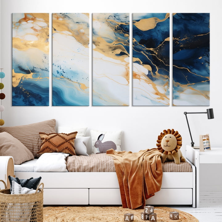 A modern living room featuring museum-quality Blue Gold Abstract Wall Art Print Contemporary art in a triptych arrangement.