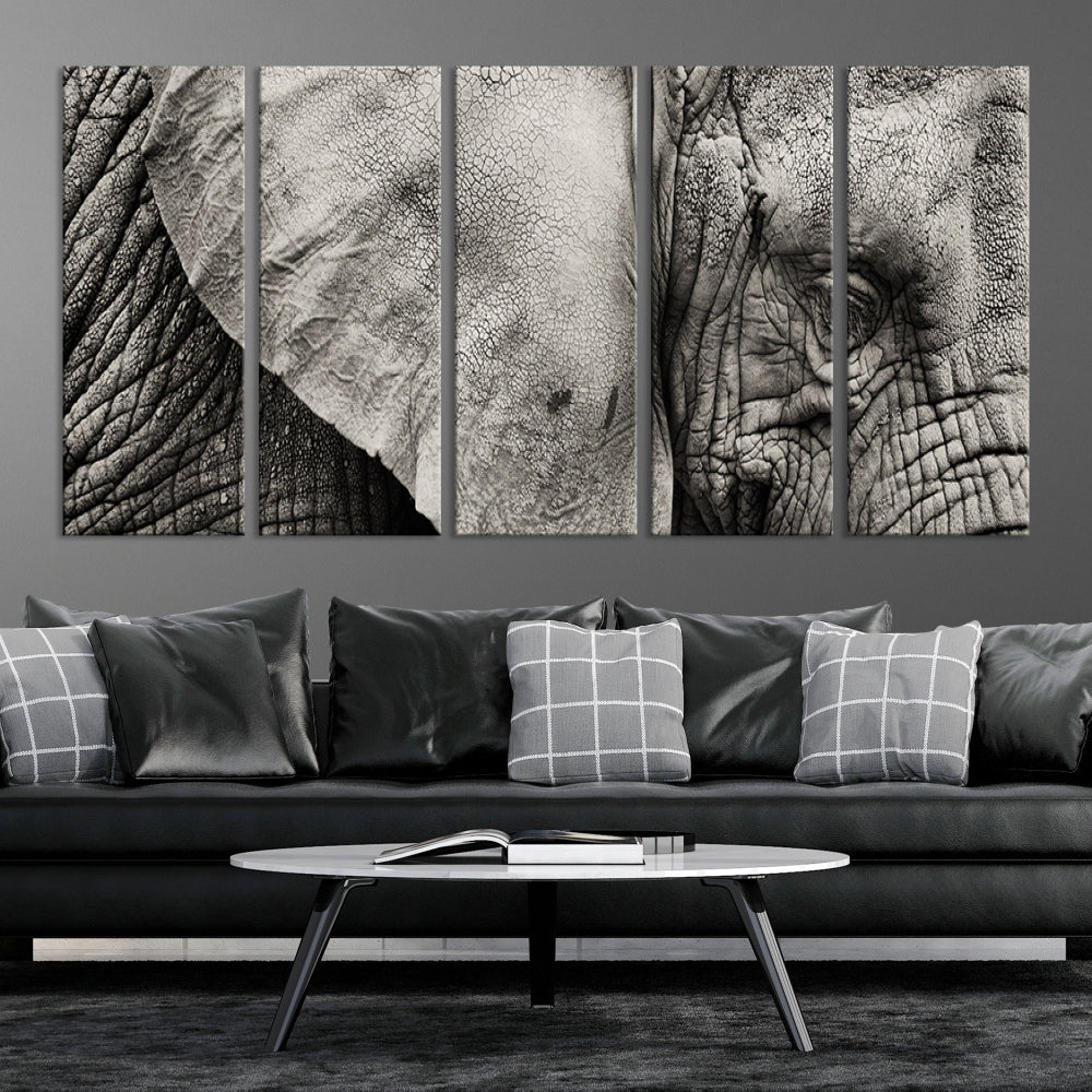 A modern living room features a large Elephant Wall Art Canvas Print in black and white, crafted on museum-quality canvases with UV-protective coating to maintain its elegance.