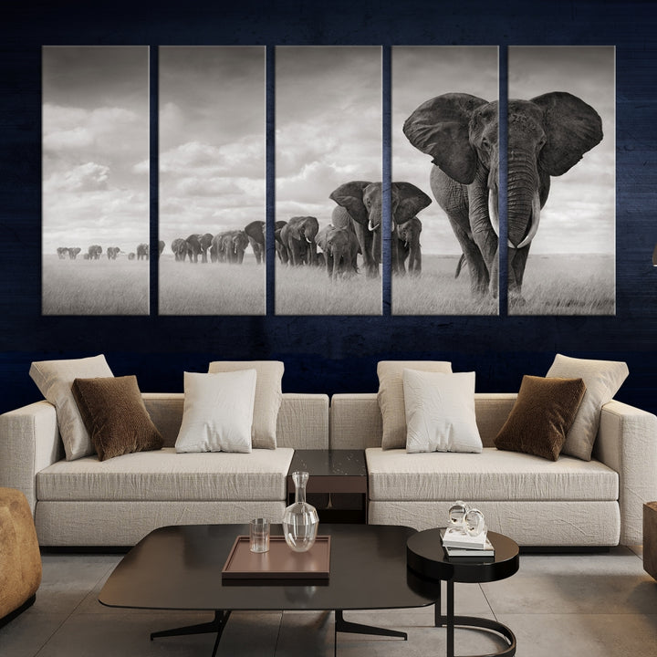 The Elephant Wall Art Canvas Print features a triptych of elephants in a savanna, elegantly displayed.