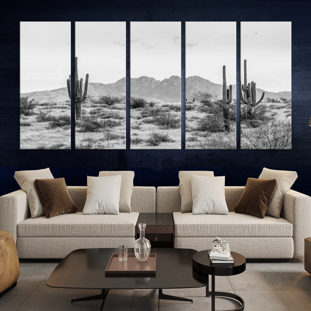 The modern living room showcases the "Black White Arizona Desert Canvas Wall Art Cactus Farmhouse Wall Art," a triptych consisting of gallery-wrapped, museum-quality black-and-white desert landscape photographs featuring cacti.