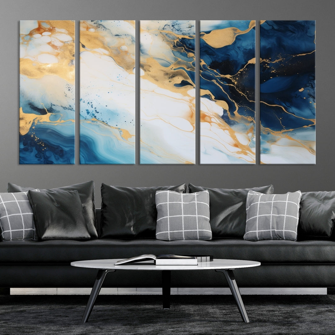 A modern living room featuring museum-quality Blue Gold Abstract Wall Art Print Contemporary art in a triptych arrangement.