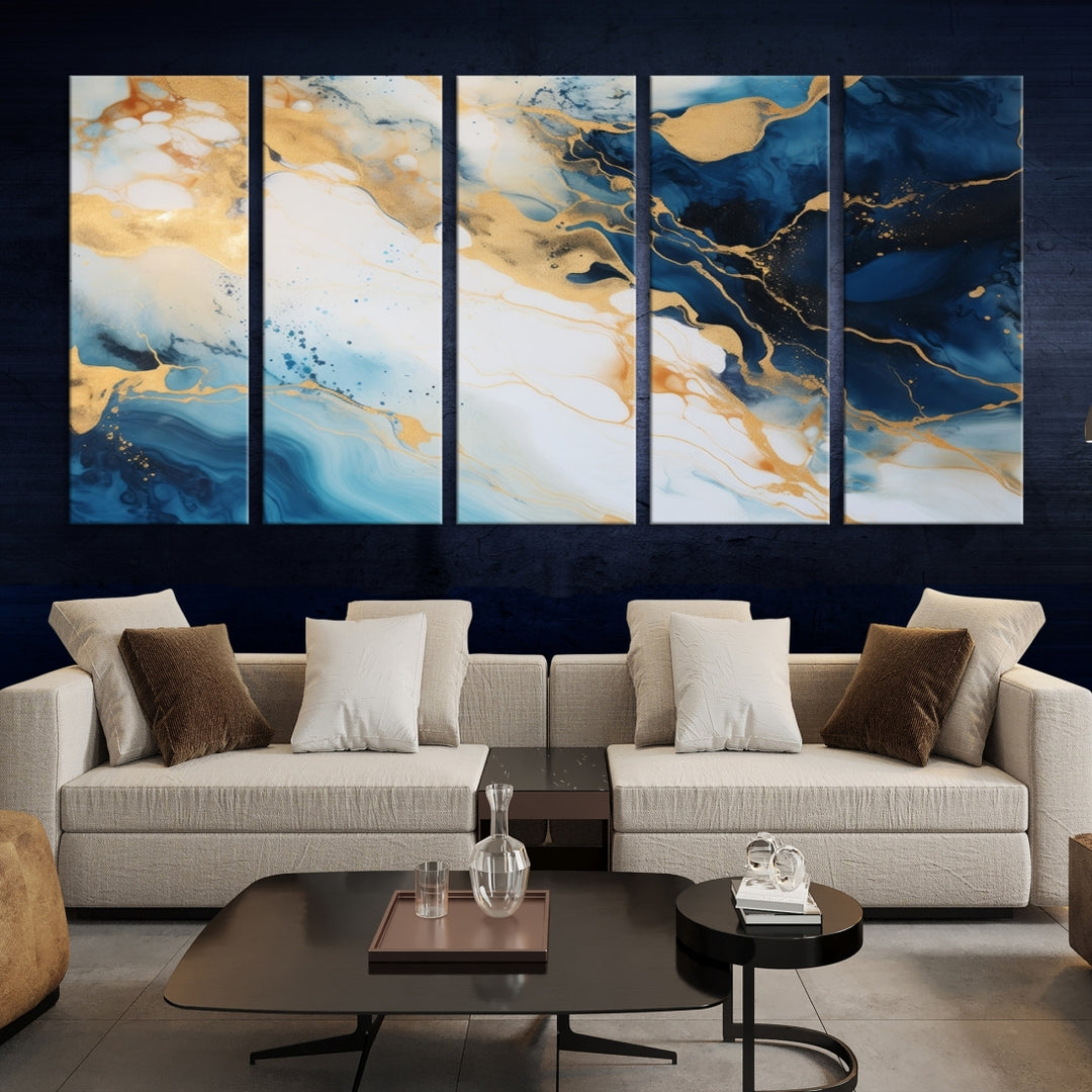 A modern living room featuring museum-quality Blue Gold Abstract Wall Art Print Contemporary art in a triptych arrangement.