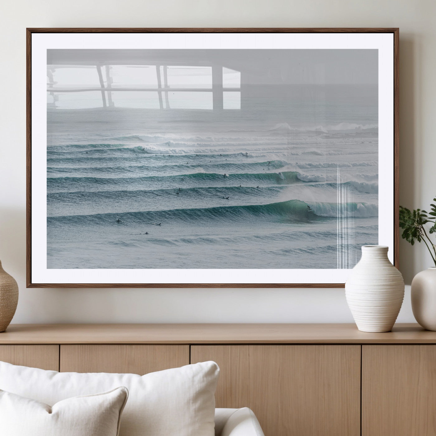 High-angle view of surfers lining up across layered ocean waves, ideal for minimal coastal or surf-inspired room decor.