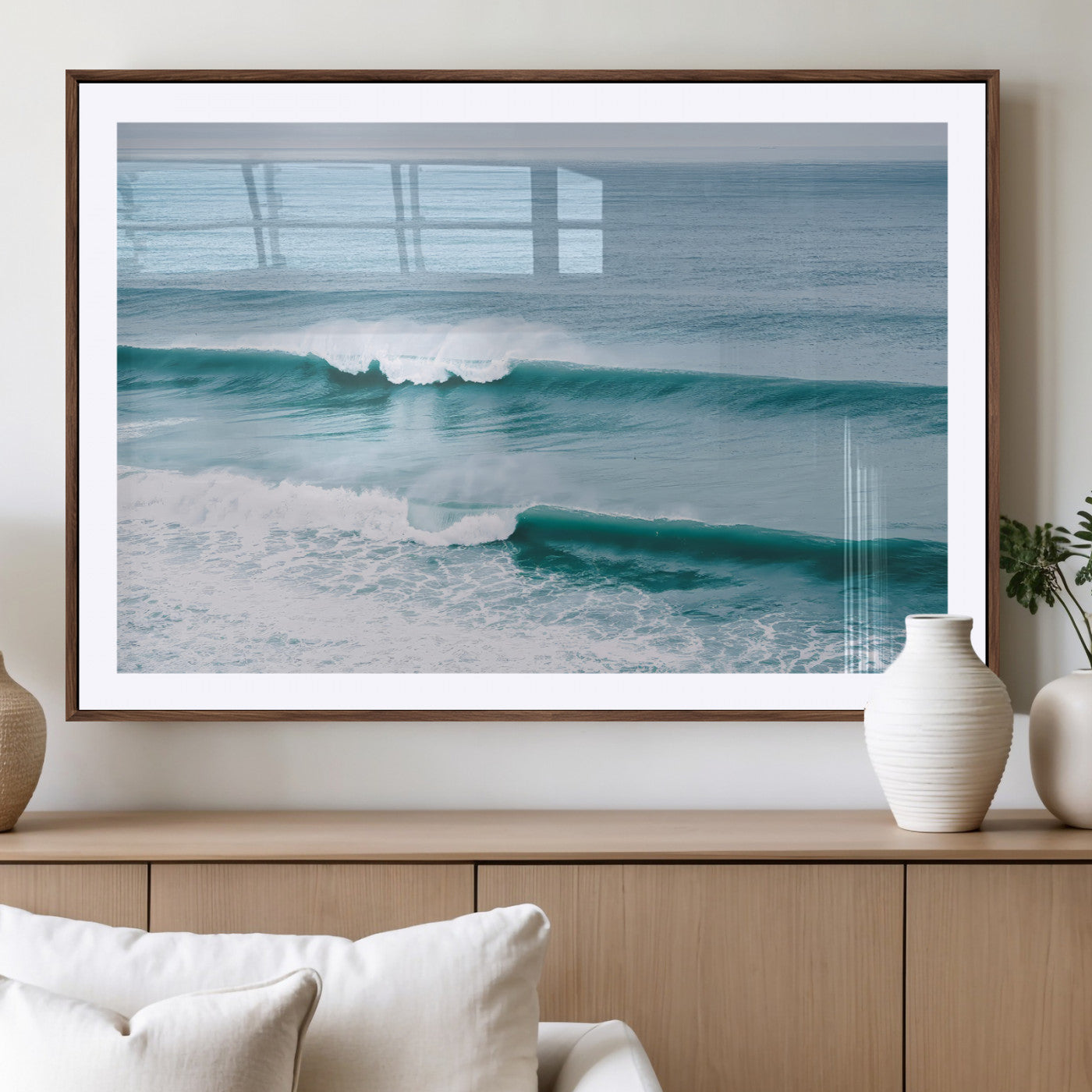 Powerful ocean waves rolling towards the shore, their turquoise hues blending with white sea foam under an open horizon, capturing the essence of the ocean's movement.