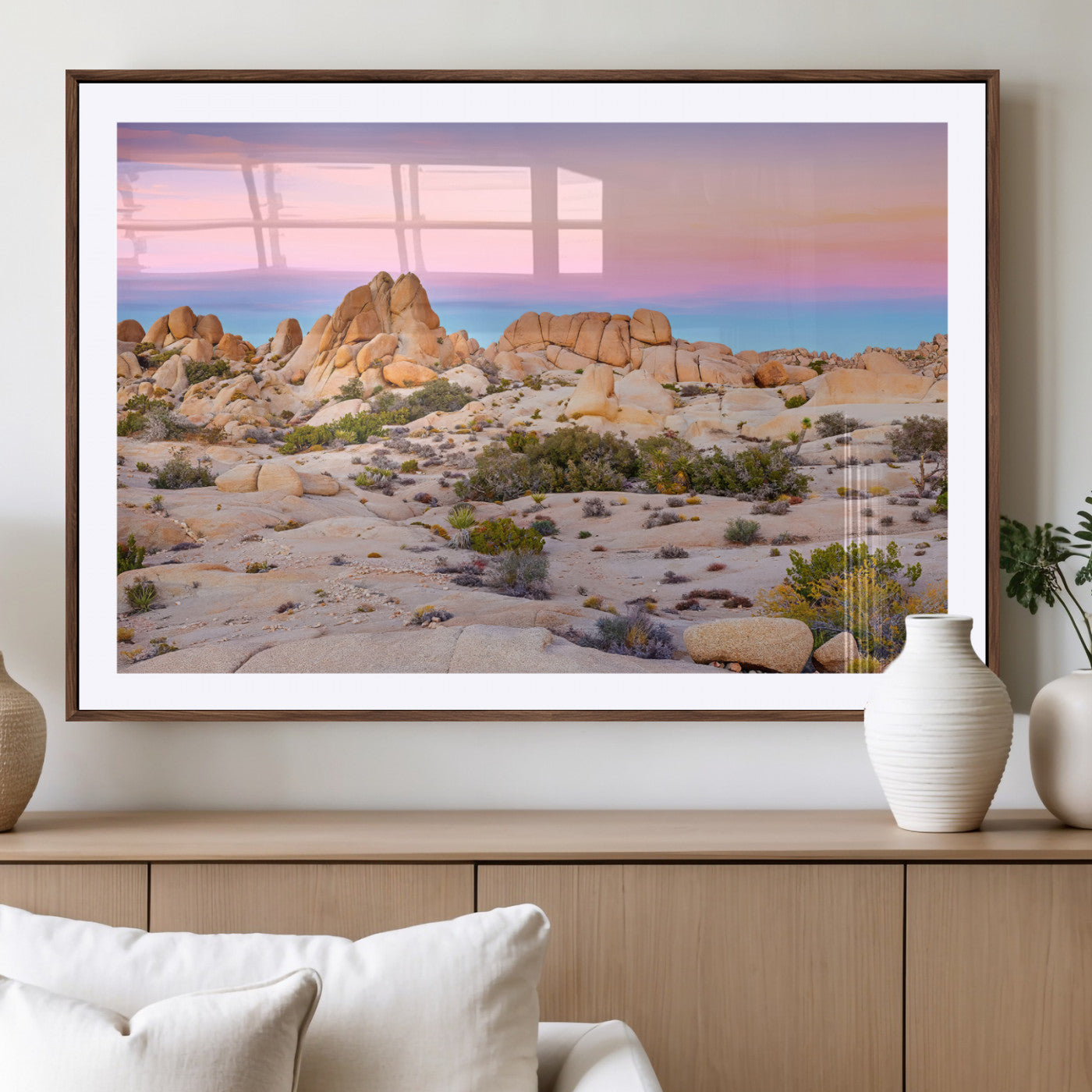 A breathtaking desert landscape featuring rugged rock formations under a vibrant pastel sunset sky, capturing the warmth and serenity of a Southwestern wilderness.