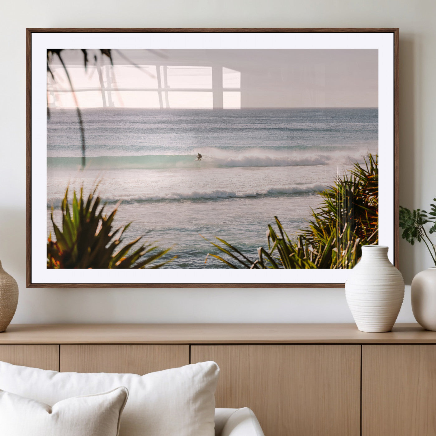 Canvas of a lone surfer riding a pastel wave at sunrise, perfect for tropical or coastal-themed spaces with a relaxed, airy vibe.
