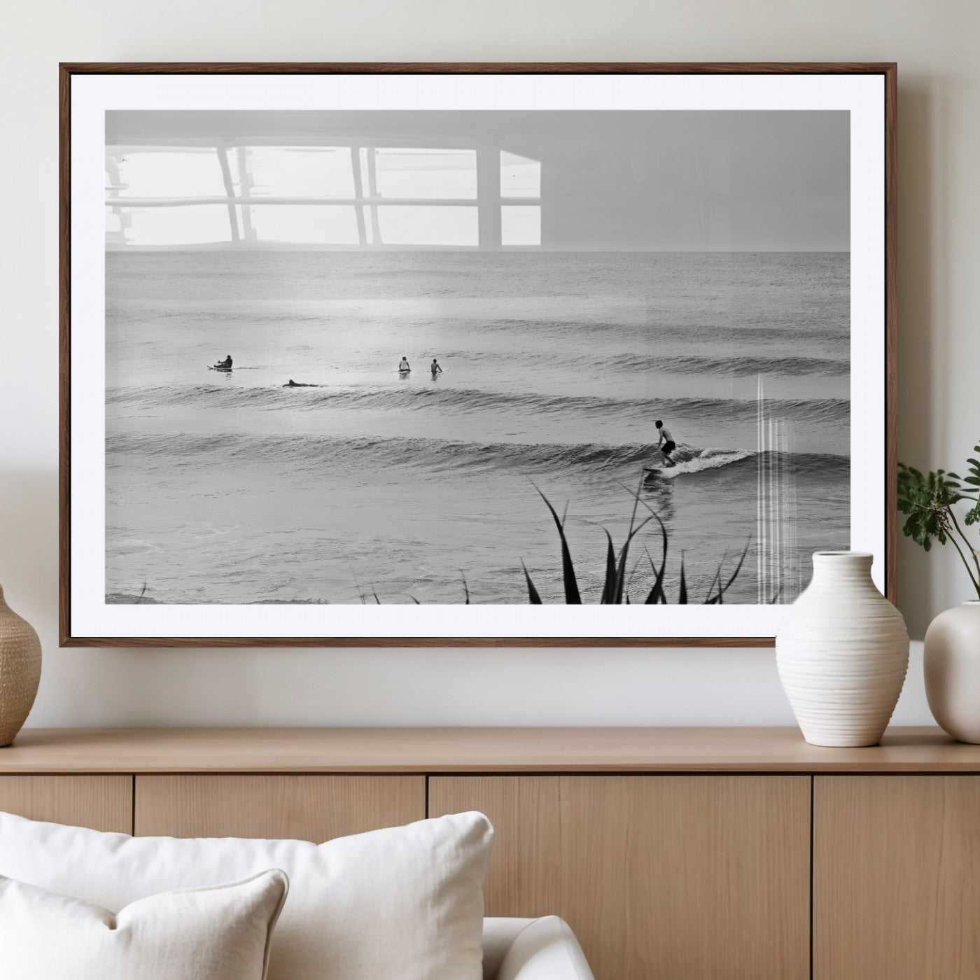 Monochrome canvas of surfers on calm ocean waves, ideal for minimalist coastal or beach-inspired interior decor.