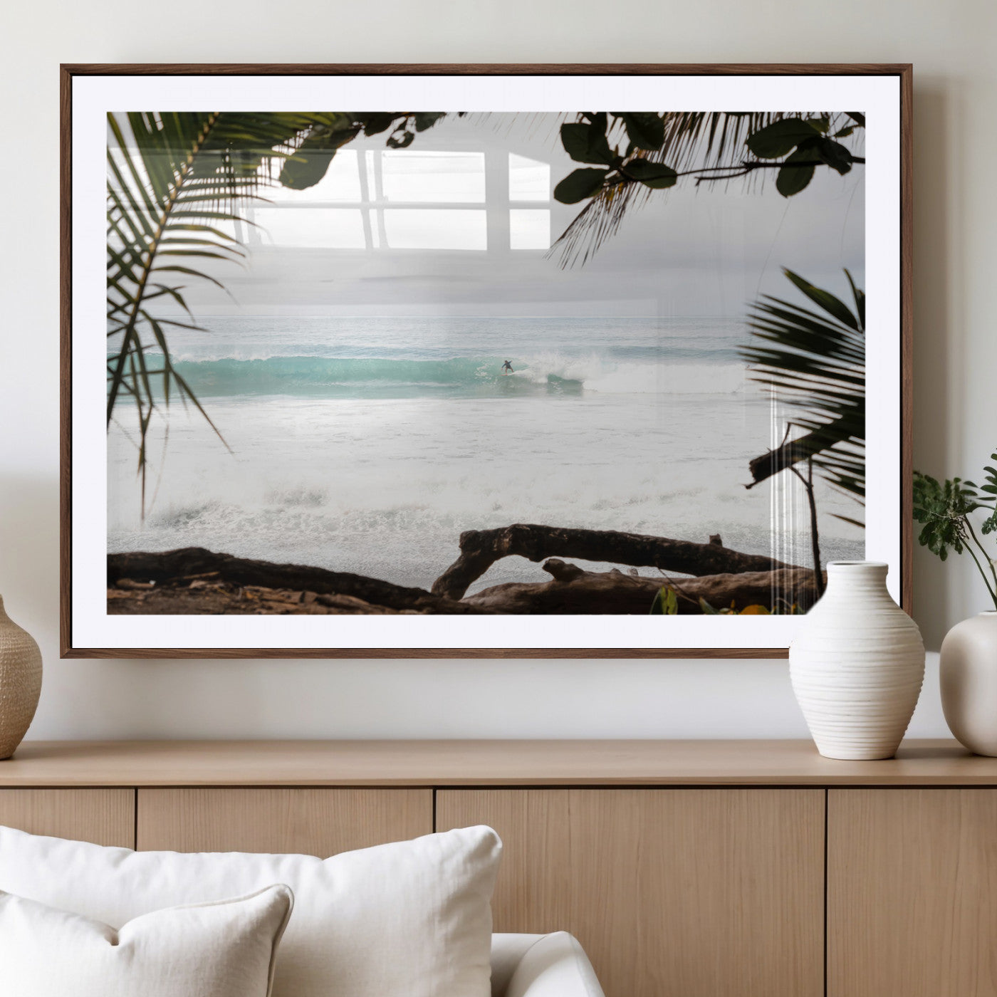 Tropical beach view with palm trees and surfer riding a wave, perfect for boho or coastal-inspired interior wall decor.