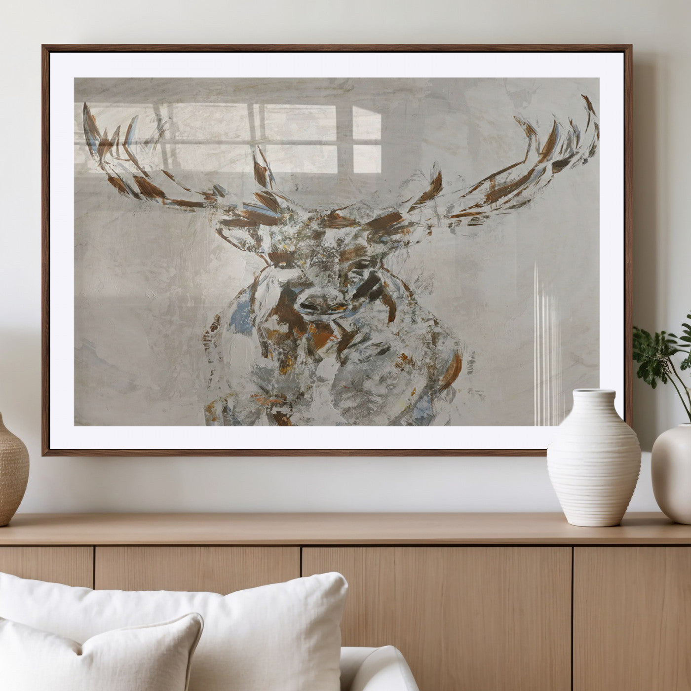 Abstract painting of a deer with antlers in neutral earth tones, ideal for modern rustic or lodge-style living room wall decor.