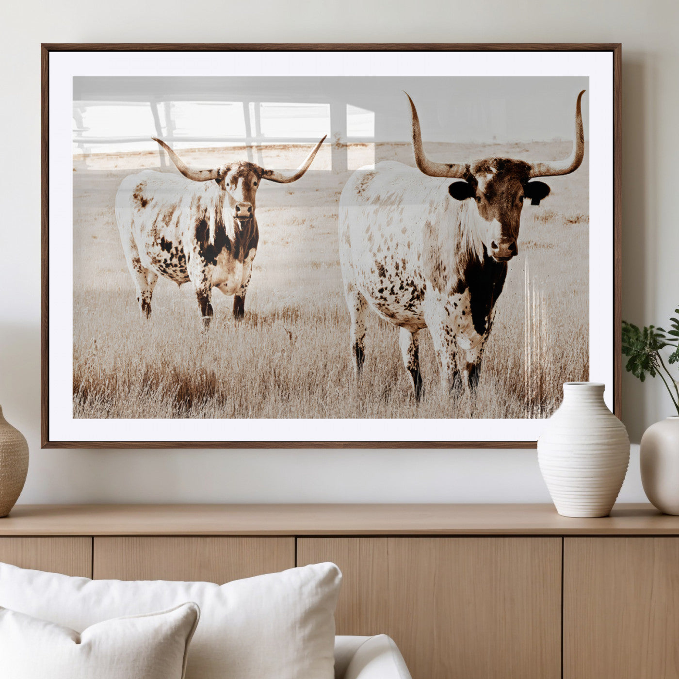 Two Texas longhorn cows standing in a sepia-toned pasture, evoking rustic charm perfect for farmhouse or western country interiors. (