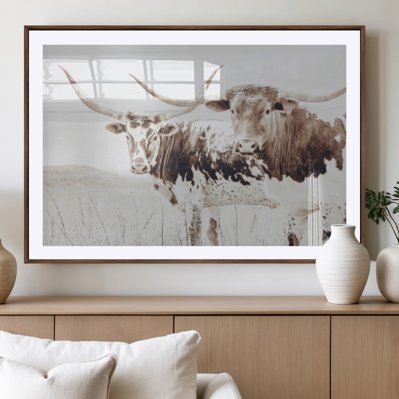 Two longhorn cows standing in a sepia-toned pasture with soft light, ideal for rustic or farmhouse-themed neutral wall decor.