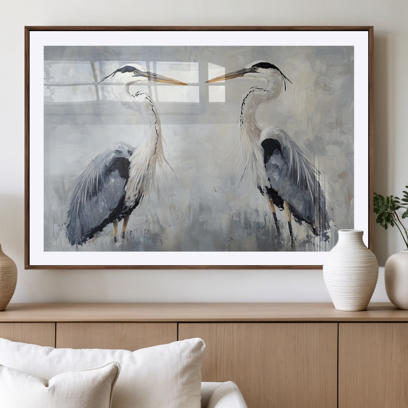 Two herons facing each other on a soft-toned background with blue-grey feathers, perfect for tranquil, coastal or nature-themed interiors.
