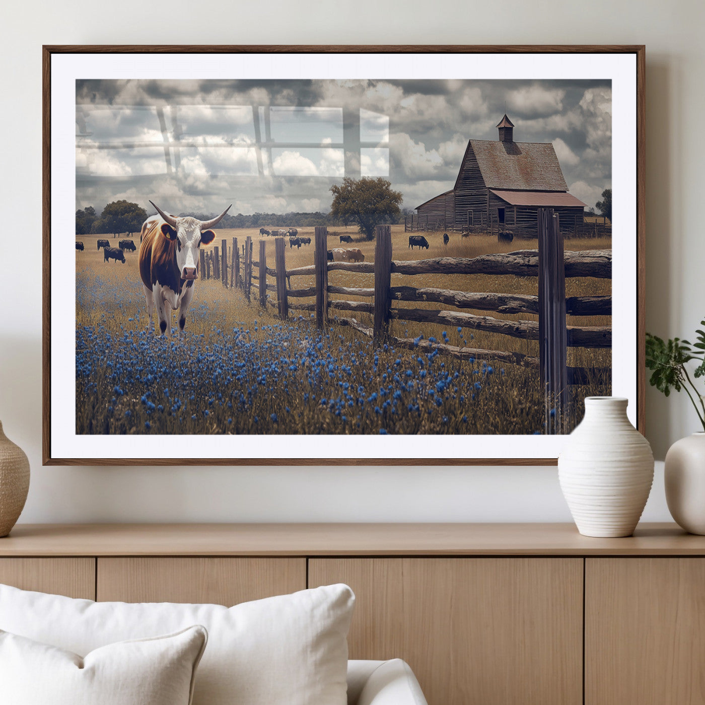 Framed canvas print of a Texas Longhorn near a rustic barn and fence, ideal for farmhouse or western-style home wall decor.