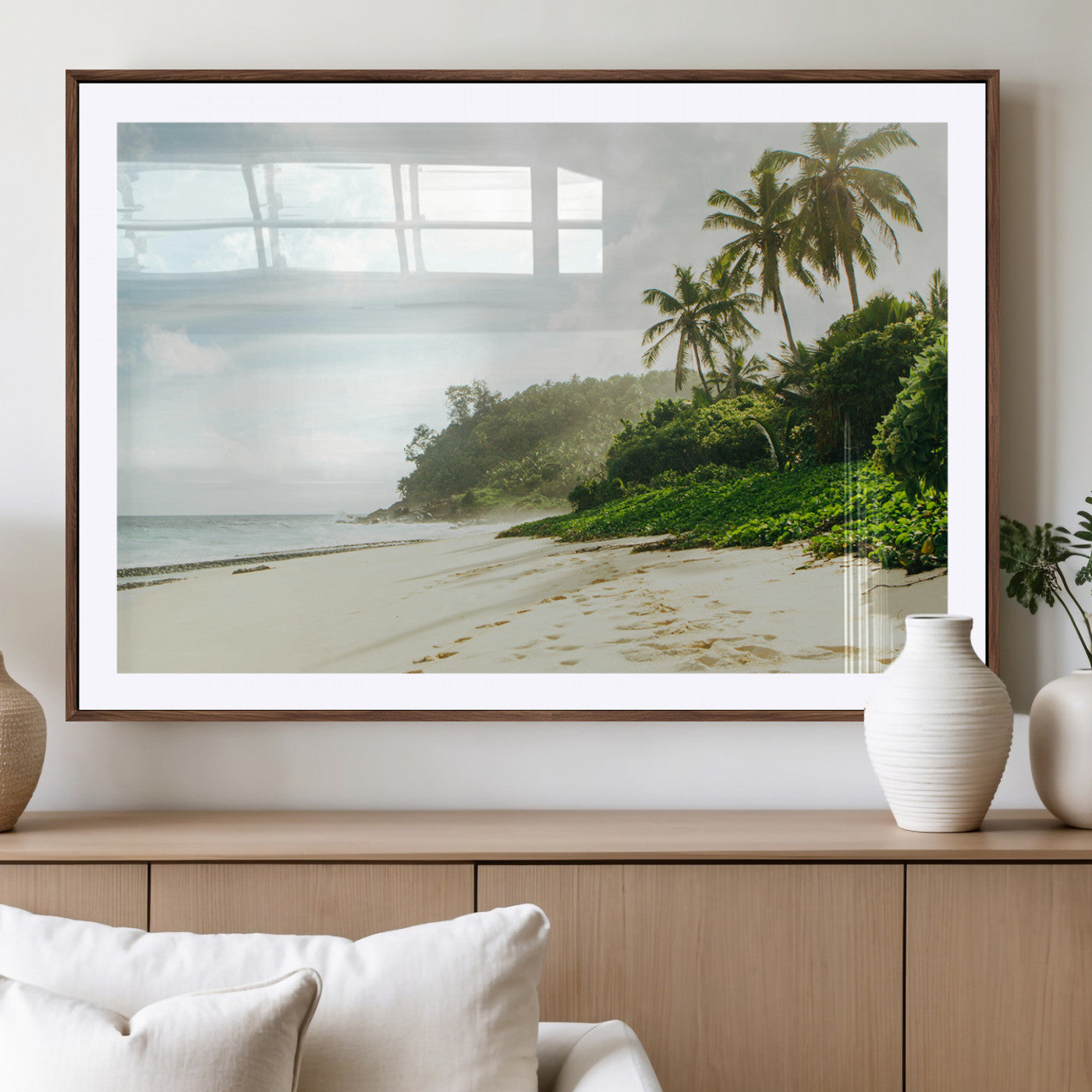A tropical beach with palm trees, soft sand, and ocean waves under a bright sky, creating a peaceful and relaxing coastal view.