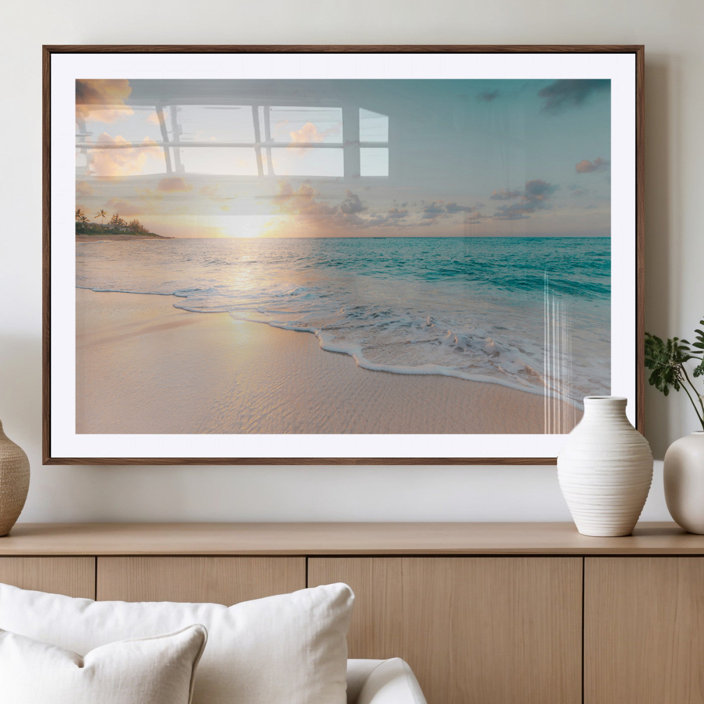 Golden sunset over a tropical beach with gentle ocean waves and soft white sand, creating a peaceful and relaxing coastal scene.