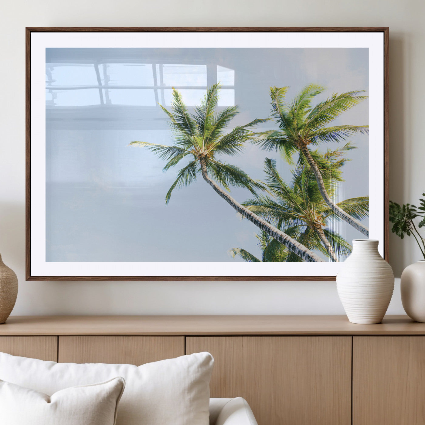 Tall palm trees swaying under a bright blue sky, capturing a tropical and minimalist beach vibe, perfect for coastal-inspired wall art.