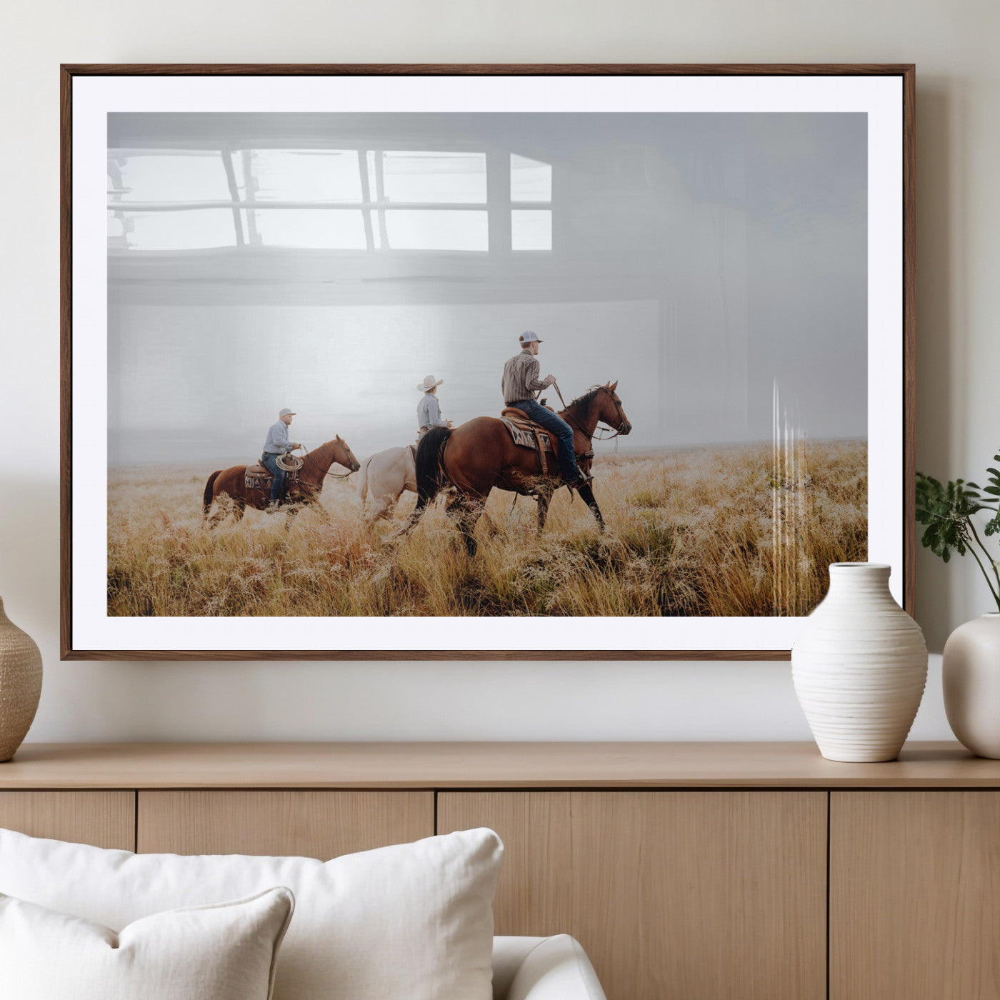 Three cowboys riding horses through a foggy prairie landscape, dressed in Western attire, evoking a rustic and adventurous Wild West aesthetic.