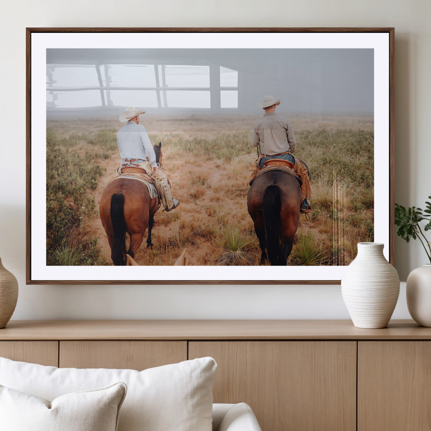Two cowboys riding horseback through a misty prairie, capturing the rustic and adventurous spirit of the Western frontier.