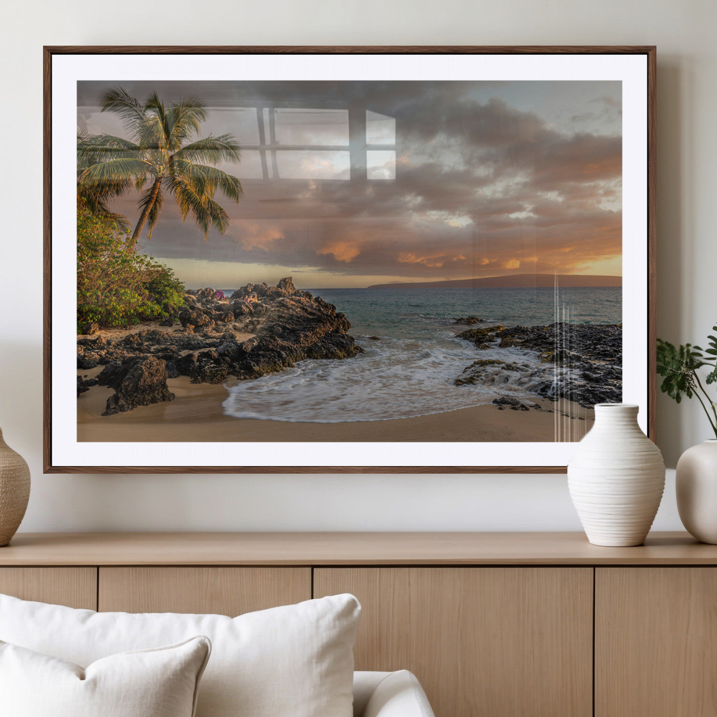 Golden sunset over a tropical beach with palm trees, rocky shoreline, and gentle ocean waves, perfect for coastal and island-inspired decor.