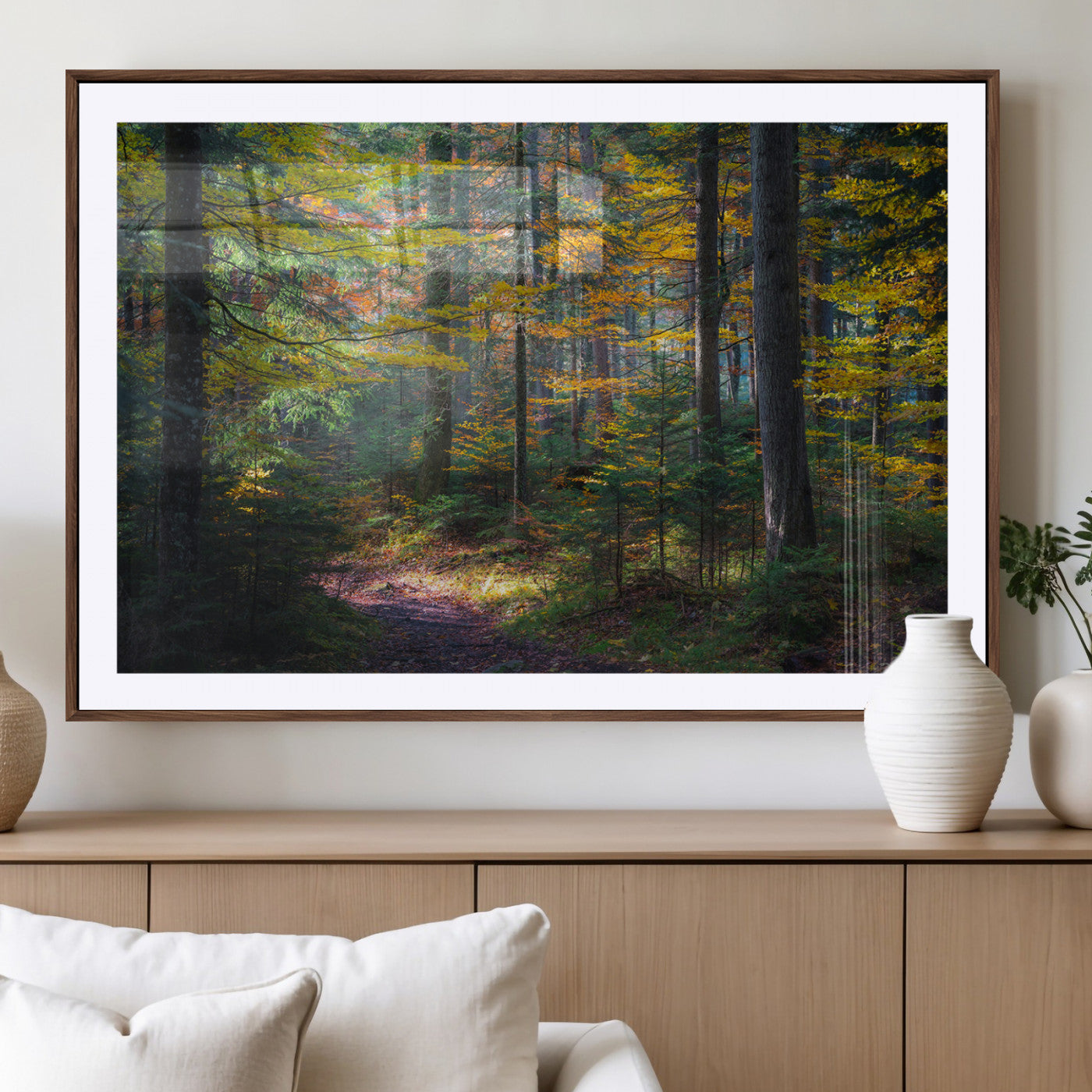 A serene autumn forest with golden and green leaves, a misty atmosphere, and a sunlit pathway, creating a tranquil nature-inspired wall art piece.