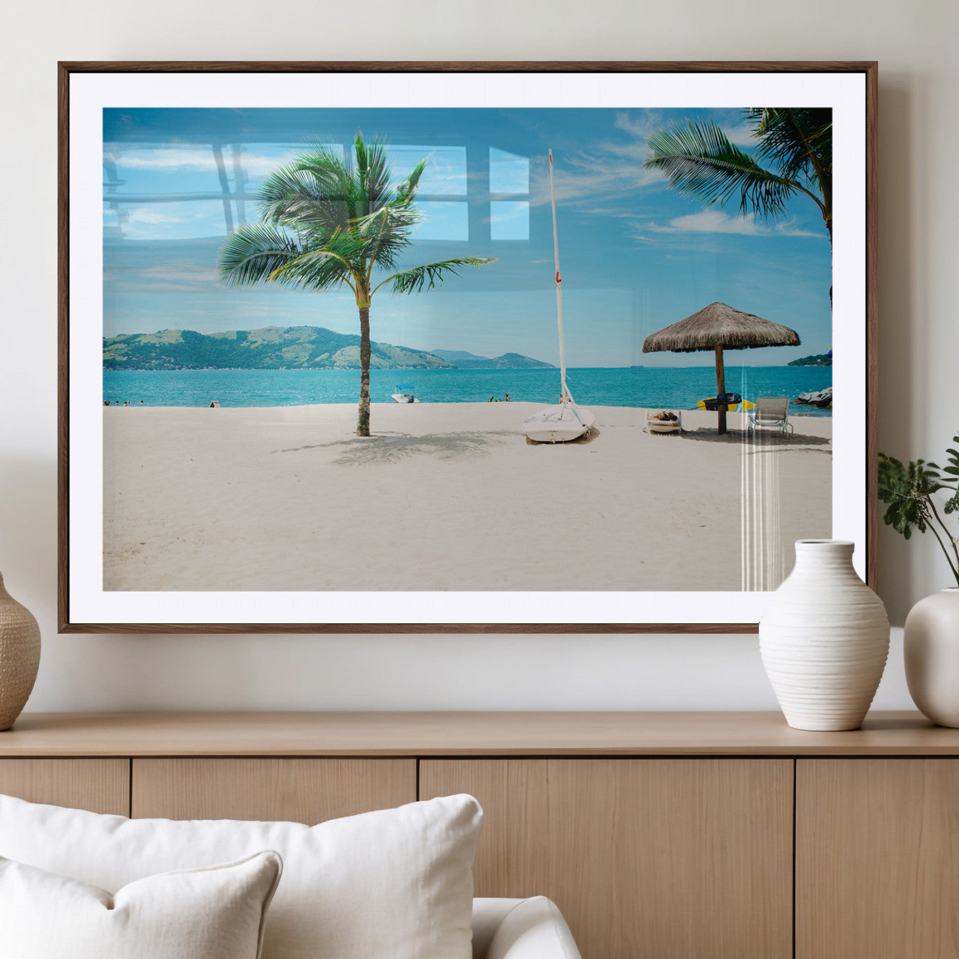 Tropical beach scene with palm trees, a white sailboat, and turquoise ocean waters under a bright blue sky, creating a peaceful summer vibe.