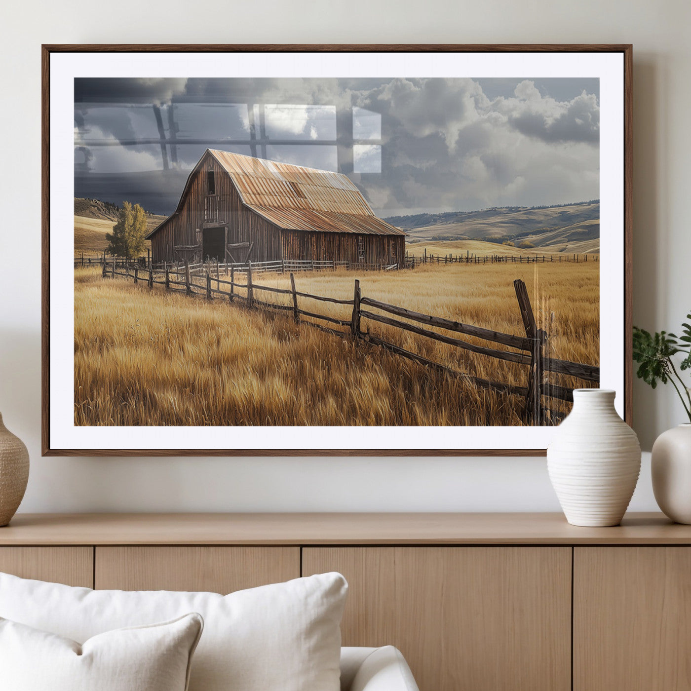 "Rustic barn surrounded by golden fields, a wooden fence, and dramatic storm clouds in the sky, capturing a serene countryside landscape."