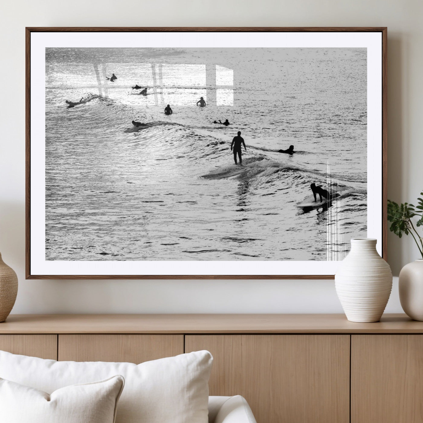 19970637-MGC-FP-40x30_Walnut-Black and white artistic view of surfers riding and paddling on waves in the ocean, capturing the dynamic motion and energy of surfing