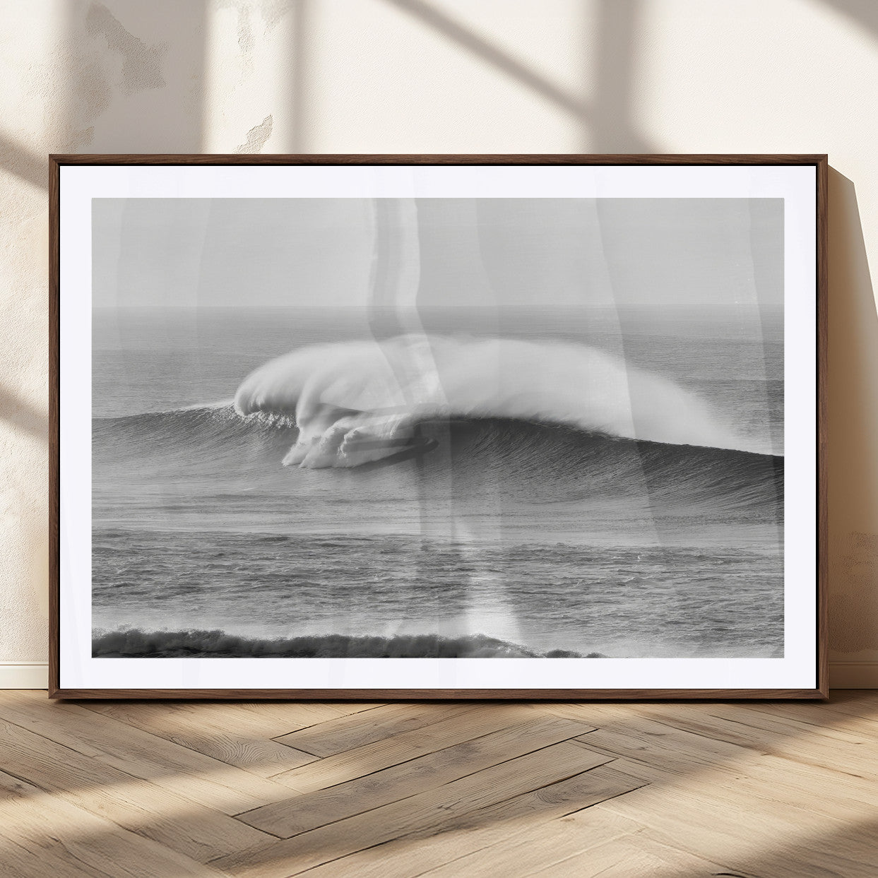 A dramatic black and white ocean wave crashing with immense force, capturing the raw power and movement of the sea in a bold seascape.