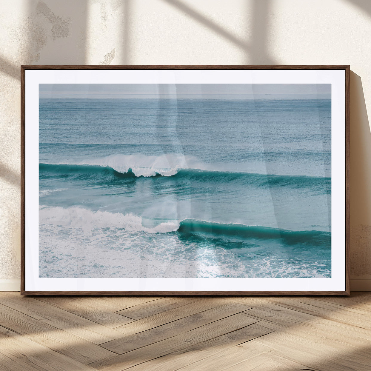 Powerful ocean waves rolling towards the shore, their turquoise hues blending with white sea foam under an open horizon, capturing the essence of the ocean's movement.