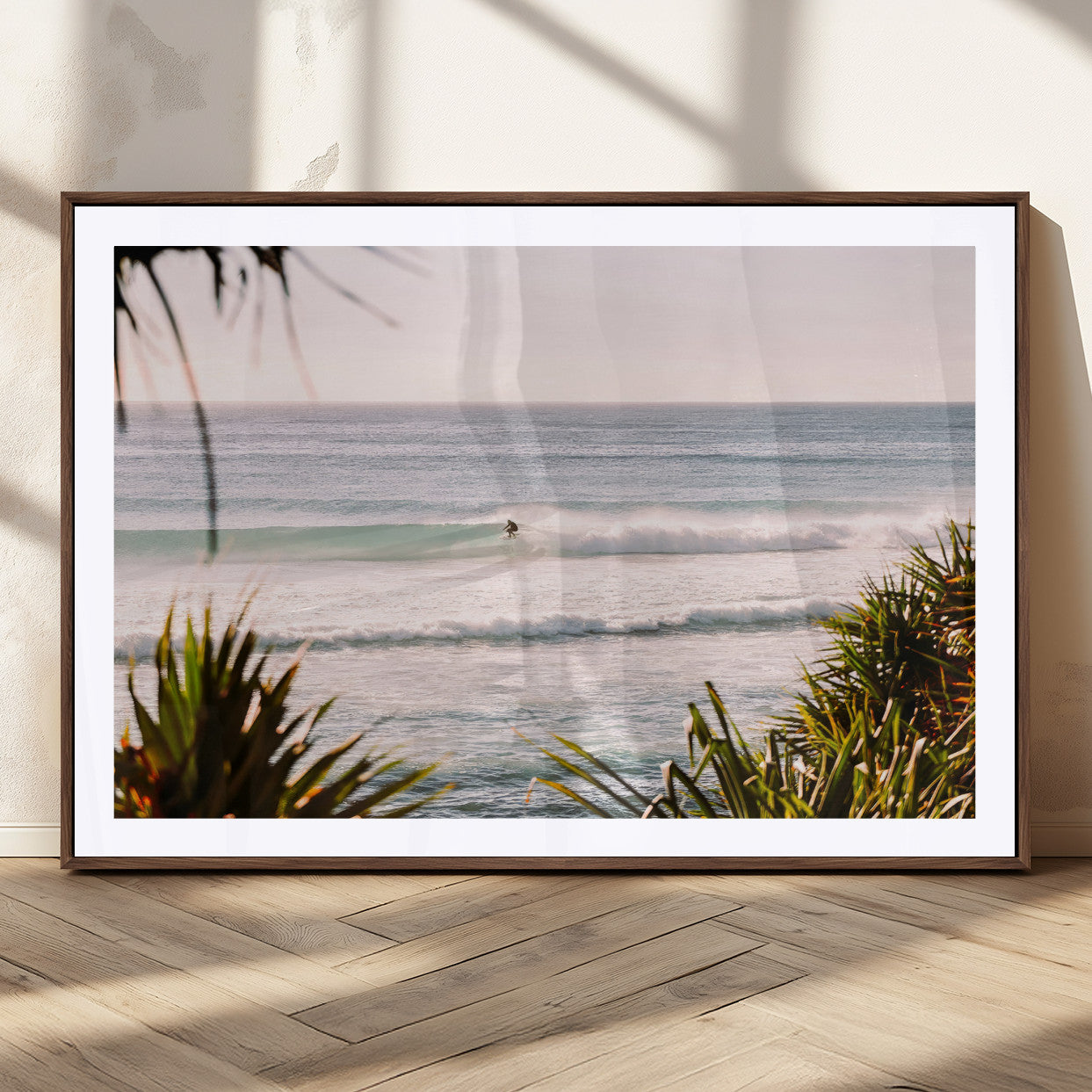 Canvas of a lone surfer riding a pastel wave at sunrise, perfect for tropical or coastal-themed spaces with a relaxed, airy vibe.