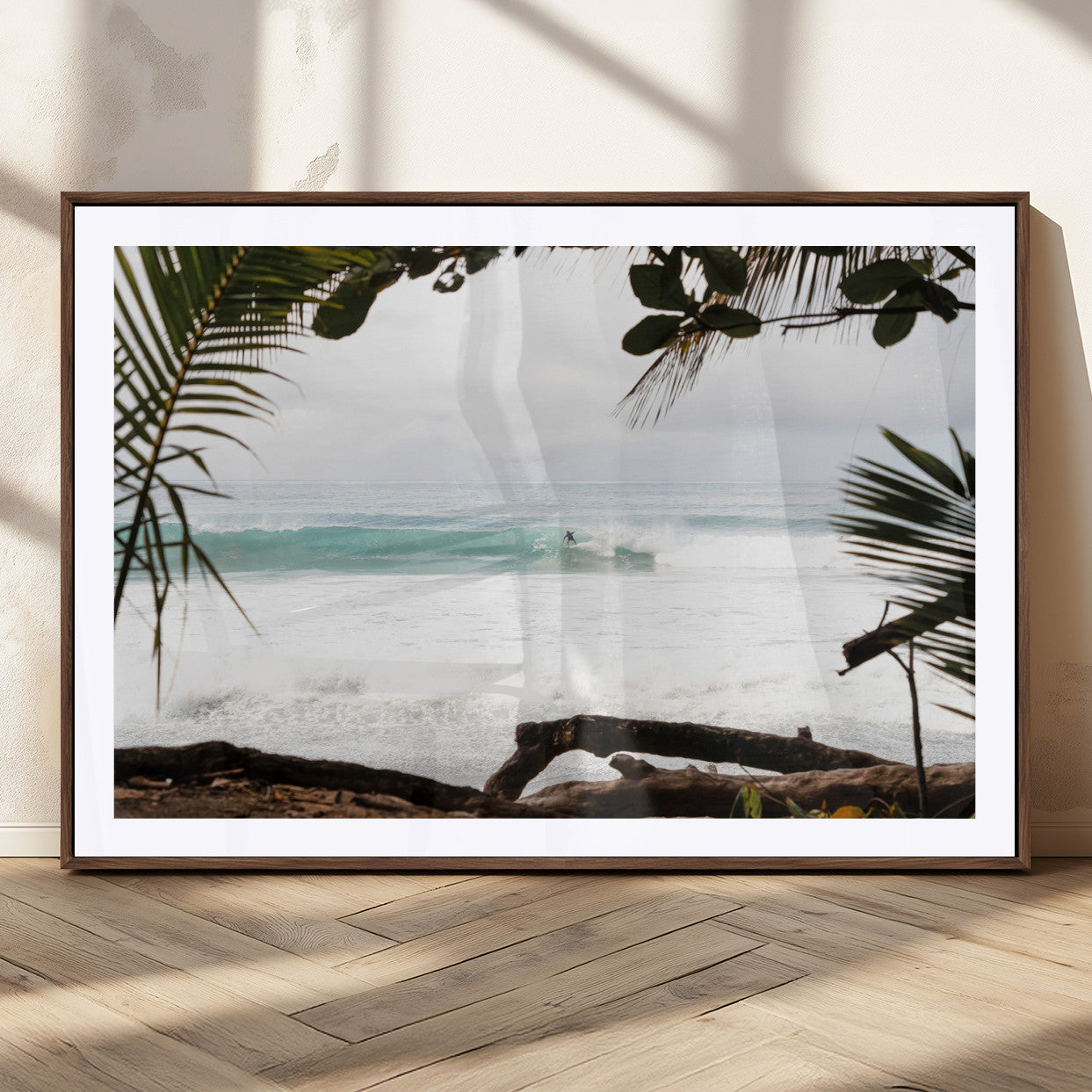 Tropical beach view with palm trees and surfer riding a wave, perfect for boho or coastal-inspired interior wall decor.